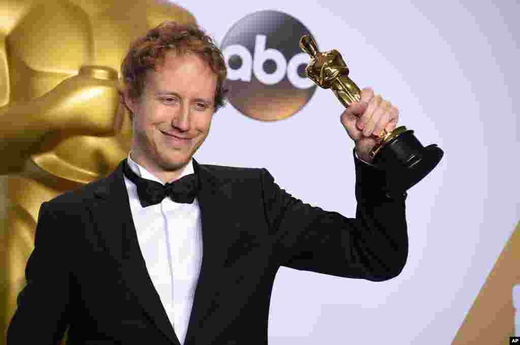 Laszlo Nemes, of Hungary, poses with the award for best foreign language film for “Son of Saul” in the press room at the Oscars on Feb. 28, 2016, at the Dolby Theatre in Los Angeles.