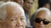 Former Khmer Rouge leaders Khieu Samphan, left, and Nuon Chea, right, look on during the funeral for Khieu Ponnary, the first wife of Khmer Rouge leader Pol Pot, in 2003. 