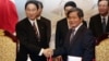 Bộ trưởng Bùi Quang Vinh (hàng đầu, bên phải) tiếp khách nước ngoài năm 2014 (ảnh tư liệu)