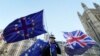 An anti Brexit demonstrator waves EU and British flags in Westminster in London, Dec. 8, 2017. 