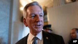 FILE - Senator Tommy Tuberville talks to reporters in Washington, Sept. 6, 2023. Tuberville is blocking the quick promotion of the top military aide to Defense Secretary Lloyd Austin.