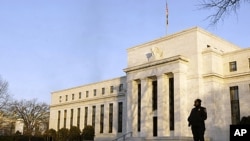 FILE - The Federal Reserve Building in Washington.