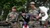 Indian army soldiers display seized arms and ammunition at the army headquarters in Srinagar, India, August 16, 2013. 