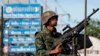 A Thai soldier mans a machine gun as his unit takes position in central Bangkok, May 20, 2014.