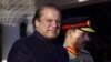 Newly elected Prime Minister of Pakistan Nawaz Sharif (L) arrives at the Prime Minister''s house to review guards of honor in Islamabad, June 5, 2013. 