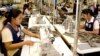 FILE: Cambodian garment workers sew clothes in a factory in Phnom Penh, Cambodia, Aug. 4, 2007. 
