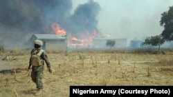 Sojojin Najeriya bayan da suka fatattaki 'yan Boko Haram daga wani sansaninsu dake dajin Sambisa a Jihar Borno