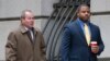 William Porter, right, one of six Baltimore city police officers charged in connection to the death of Freddie Gray, walks into a courthouse with his attorney Joseph Murtha for jury selection in his trial, Nov. 30, 2015, in Baltimore.
