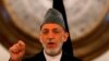 FILE - Outgoing Afghan President Hamid Karzai speaks during a gathering of government employees in Kabul Sept. 23, 2014.