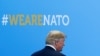U.S. President Donald Trump walks during the welcoming ceremony at the start of a NATO summit at the Alliance’s headquarters in Brussels, Belgium, July 11, 2018. 