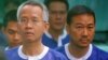 Thai activists Veera Somkwamkid, second left, a core leader of Yellow Shirts and Panich Vikitsreth, a member of Parliment of the ruling Democrat party, second right, are escorted by Cambodian court security personnel at Phnom Penh Municipal Court.