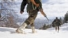 Indian army soldiers patrol near the Line of Control (LOC), the line that divides Kashmir between India and Pakistan, in Churunda village, about 150 Kilometers (94 miles) northwest of Srinagar, India, January 15, 2013.