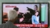 South Korean man watches a TV news program reporting missile launch conducted by North Korea in Seoul May 20, 2013.