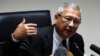 Thailand's interim prime minister Niwatthamrong Boonsongphaisan gestures during a news conference at the Permanent Secretary of Defence in Bangkok, May 12, 2014. 