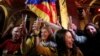 People react to results in Catalonia's regional elections at a gathering of the Catalan National Assembly in Barcelona, Spain, Dec. 21, 2017. 