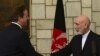 Afghan President Hamid Karzai, right, shakes hands with British Prime Minister David Cameron during a press conference at the presidential palace in Kabul, Afghanistan, June 29, 2013.