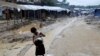 A Rohingya refugee child washes utensils in the Balukhali refugee camp in Cox's Bazar, Bangladesh, Oct. 6, 2017. 
