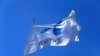FILE - Telenor flag flutters next to the company's headquarters in Fornebu, Norway, June 1, 2017.