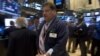 Traders work on the floor of the New York Stock Exchange July 14, 2015. 