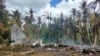 Partes do avião militar das Filipnas que caiu em Jolo, 4 de Julho de 2021