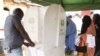 People thump print ballot papers during gubernatorial election in Kaduna, Nigeria, Thursday, April 28, 2011. Two states in Nigeria's Muslim north voted Thursday for state gubernatorial candidates after their polls were delayed by violence that killed at