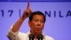 FILE - Philippines President Rodrigo Duterte gestures while addressing the media following the conclusion of the 30th ASEAN Leaders' Summit in Manila, Philippines.