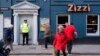 Police outside an Italian restaurant in Salisbury, England, Tuesday March 6, 2018, near to where former Russian spy double agent Sergei Skripal and his companion were found critically ill Sunday following exposure to an "unknown substance". 66-year old Sk