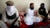 FILE - In this July 28, 2011 file photo, Taliban No 2 commander Waliur Rehman talks to the Associated Press during an interview in Shawal area of South Waziristan along the Afghanistan border in Pakistan.