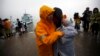 Family member of missing passengers who were on the South Korean ferry "Sewol" which sank in the sea off Jindo cry at a port where family members of missing passengers gathered in Jindo, April 18, 2014.