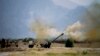 In this June 1, 2011, file photo, Pakistani troops fire heavy artillery toward alleged militants hideouts in mountain ranges along the Afghan border. 