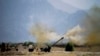 FILE - In this June 1, 2011, file photo, Pakistani troops fire heavy artillery toward alleged militants hideouts in mountain ranges along the Afghan border. 