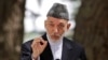 Afghan President Hamid Karzai speaks during a press conference at the presidential palace in Kabul, Aug, 24, 2013. 