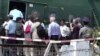 FILE - In this image made from video, U.N. Security Council ambassadors board a helicopter to fly to Maungdaw district of Rakhine State, in Sittwe, Myanmar, Tuesday, May 1, 2018. 