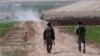 Turkish soldiers patrol near the border with Syria, ouside the village of Elbeyli, east of the town of Kilis, southeastern Turkey, July 24, 2015. Turkish warplanes struck Islamic State group targets across the border in Syria early Friday, government offi