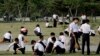 FILE - North Korean school children groom the lawn in Pyongyang, North Korea, June 16, 2017.
