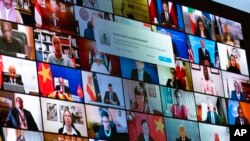 2021年4月23日，当拜登总统从白宫为虚拟世界领导人峰会致辞时，屏幕上显示出各国领导人。（美联社照片）