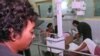 A Phnom Penh resident is treated for wounds at Calmette Hospital he received during a mortar attack in the capital in the late afternoon on Saturday July 5,1997. Fighting broke out between troops loyal to the rival prime ministers and shellfire hit downto