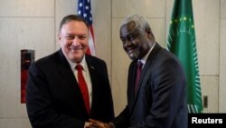 U.S. Secretary of State Mike Pompeo shakes hands with African Union Commission Chairperson Moussa Faki Mahamat at the African Union Headquarters in Addis Ababa, Ethiopia, Feb. 18, 2020. 