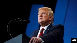 FILE - President Donald Trump speaks at the 2019 House Republican Conference Member Retreat Dinner in Baltimore, Sept. 12, 2019. 